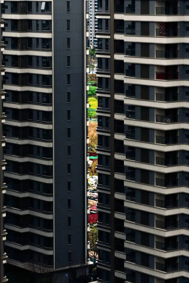 Two towers separated by a narrow slot.