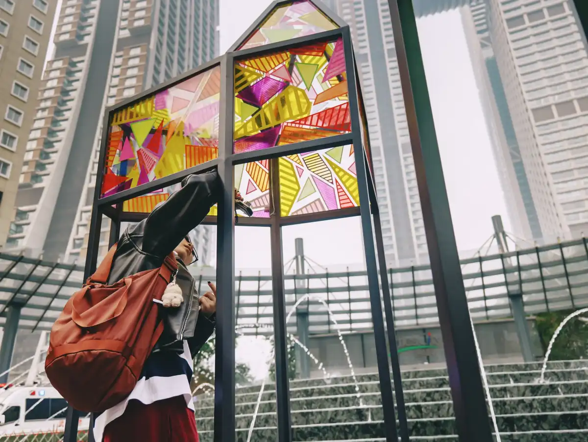 A close view of a colorful installation in a public square.